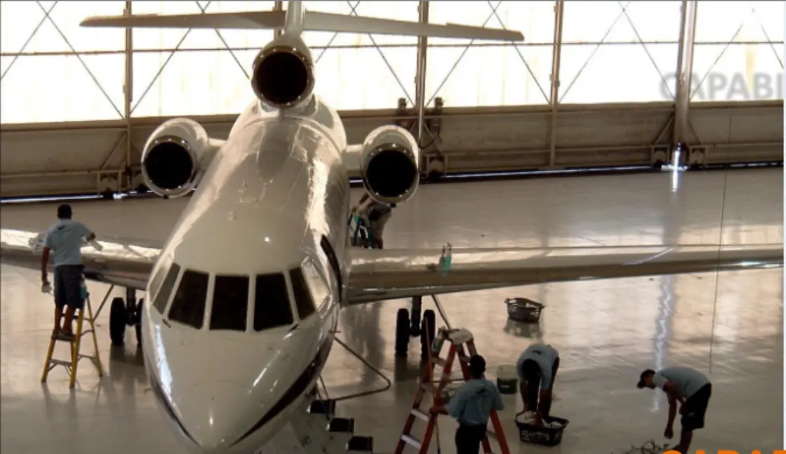 Aircraft undergoing maintenance in a hangar