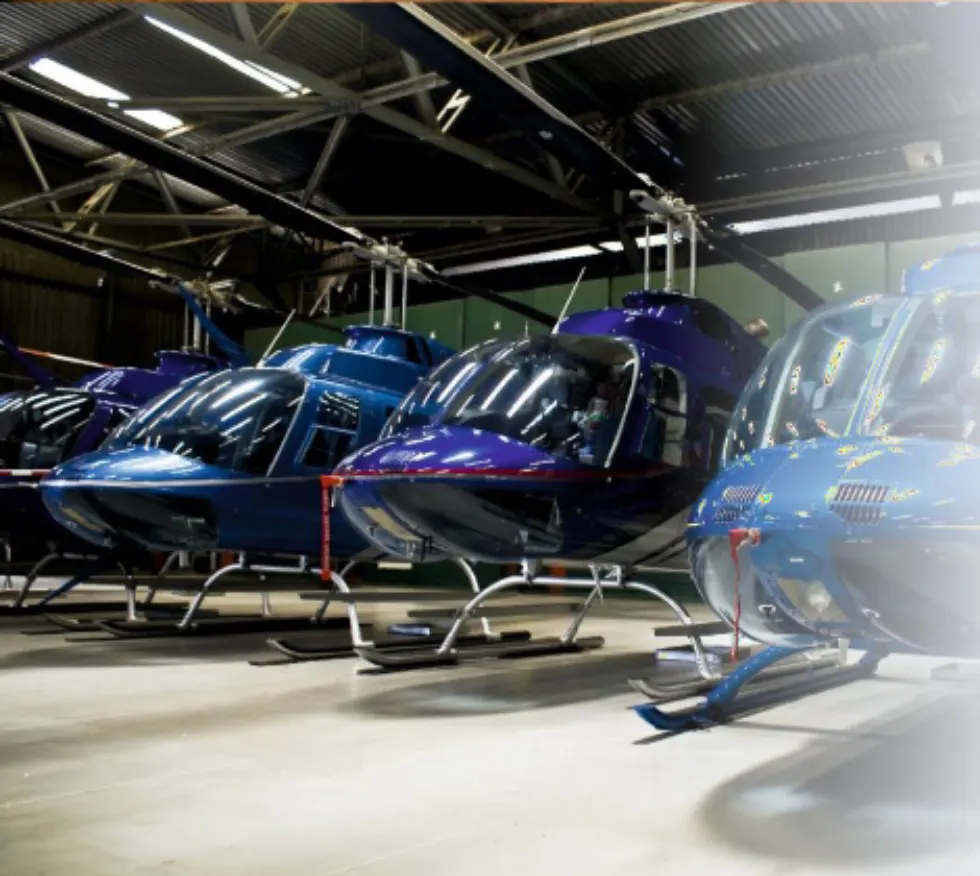 Helicopters inside an aircraft hangar